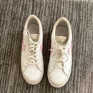 Nike Women's White Leather Sneakers with Pink Swoosh Accent